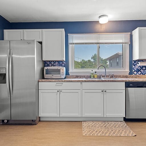 Kitchen Area, refrigerator, stove, oven, coffee maker, kitchen utensils