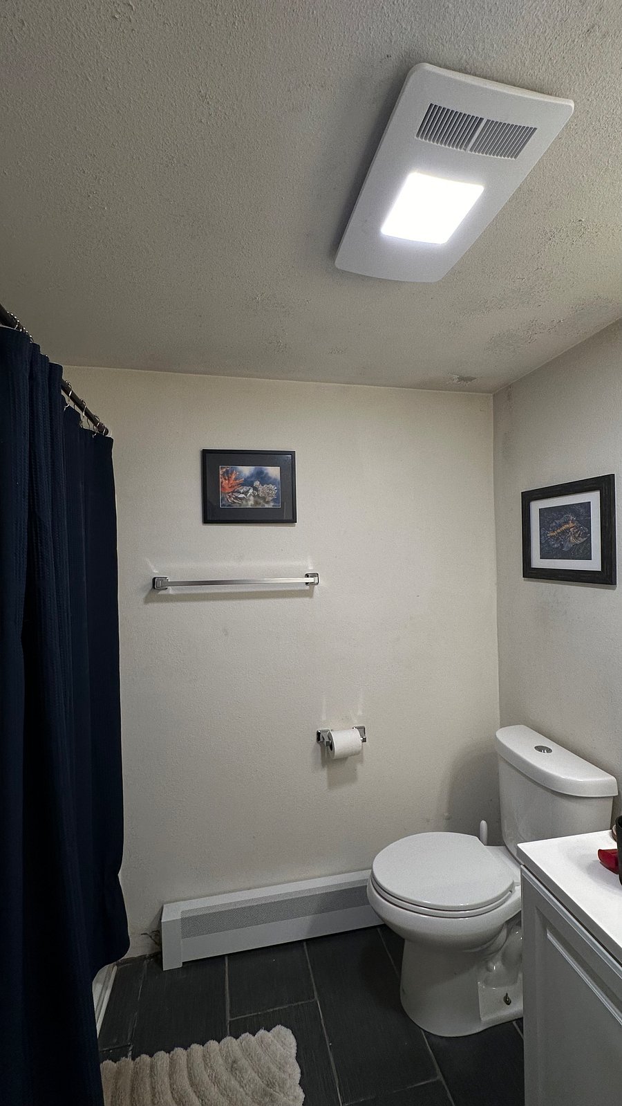 Shared full bath with lots of counter and cabinet space