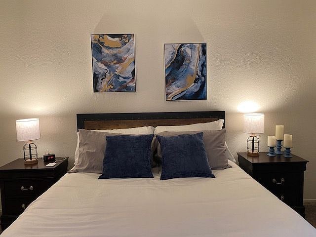 Master bedroom with queen size bed.