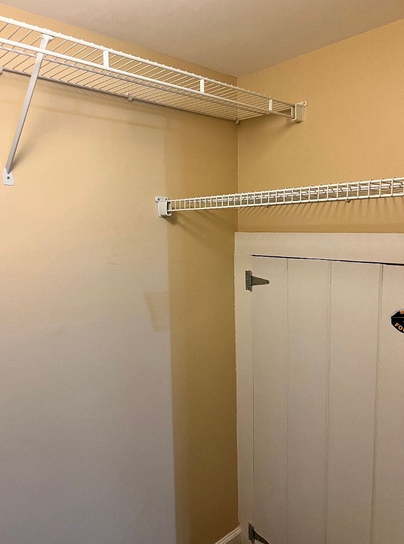 Closet space in large bedroom. Additional wire shelving on top and other side of the closet not shown. Other storage includes a small chest of drawers in the large bedroom and a smaller closet in the small bedroom.