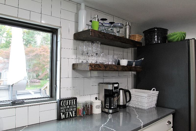 Kitchen with all essential amenities with great view of the deck dining set & private back yard.