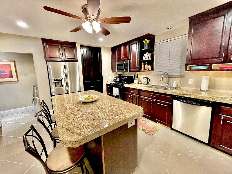 Full size kitchen with stainless French door fridge
