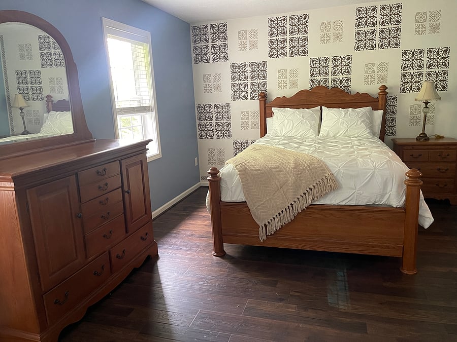 Large primary bedroom, nicely outfitted with attached bath with step in shower and large closets.