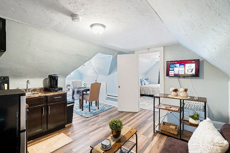 32" smart tv in the living area, with a 40" tv in the bedroom