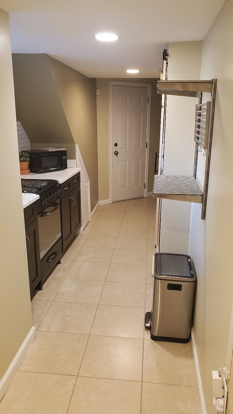 Full kitchen equipped with electric stove/oven, microwave and full sized fridge.