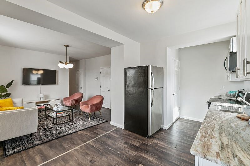 View from the entrance of the home showing the kitchen to the right and living area ahead.
The kitchen comes with an oven, a stove, a microwave, a fridge, and a freezer, so guests can prepare their own meals in privacy.