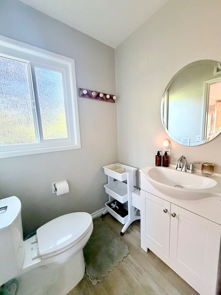 Clean and modern bathroom with all essentials provided.