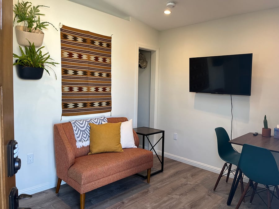 Beautiful living room with loveseat and eating/workspace