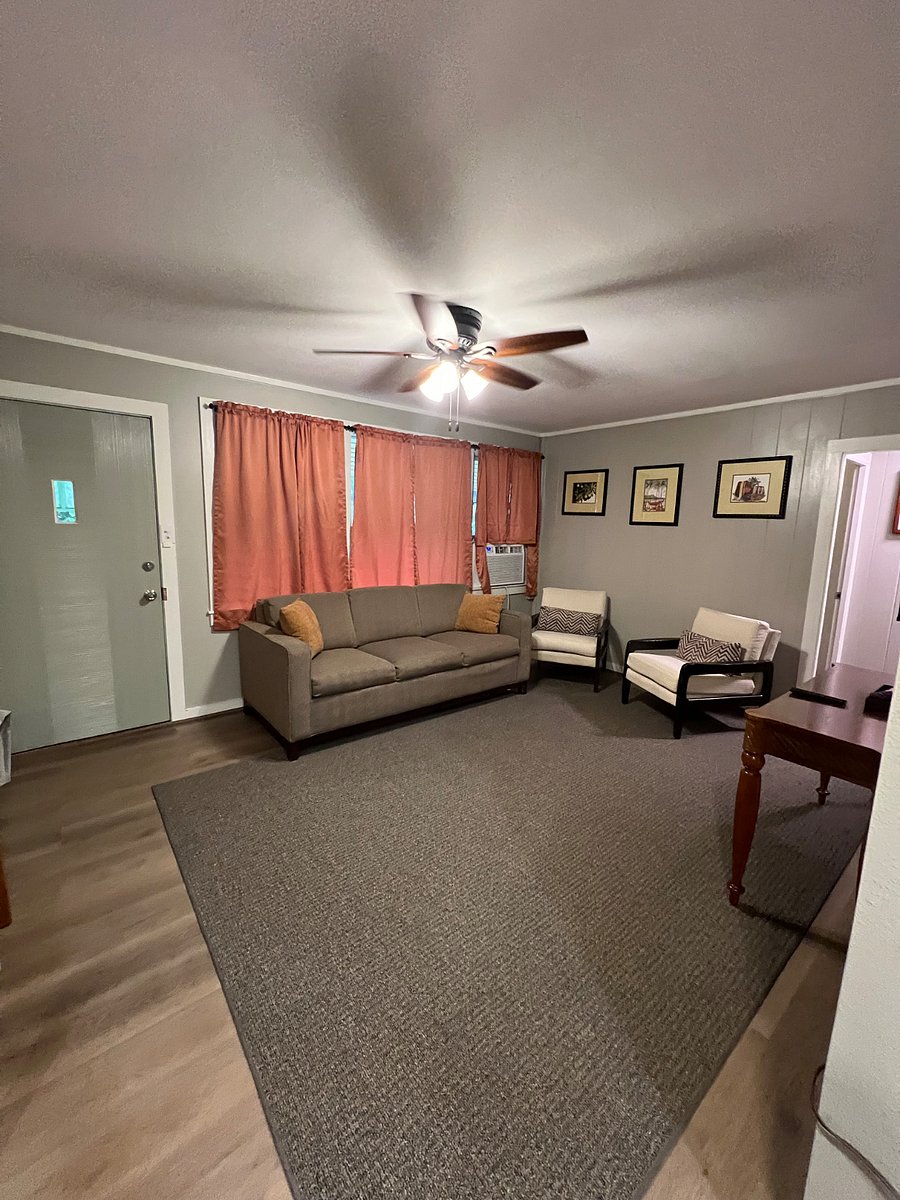 Living room with a large window a/c sufficient to keep the area cool providing that all windows and doors are closed.