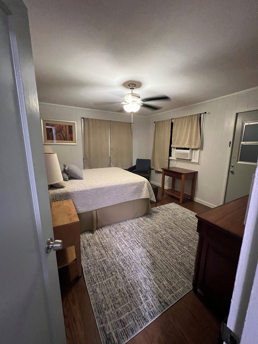 Master bedroom, queen bed, window a/c.
