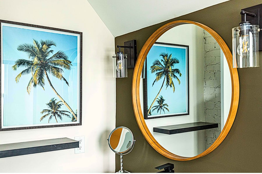 Palm tree art and a large vanity make getting ready a breeze.