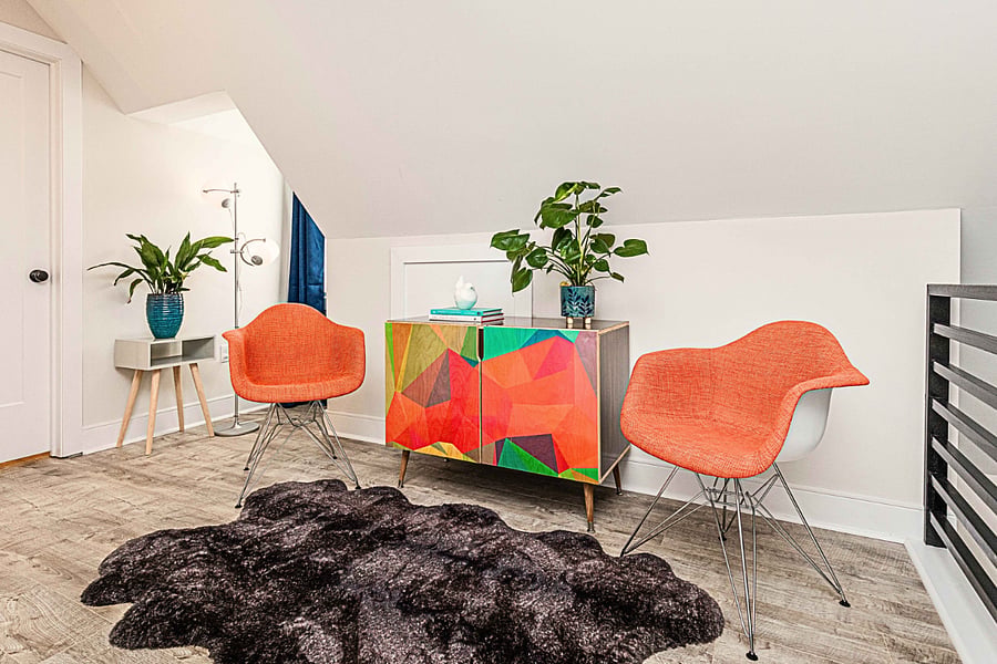 This upstairs reading area in the Master Suite is a guest favorite. Curl up in the orange chairs with morning coffee, or use it as a quiet place for private phone calls.