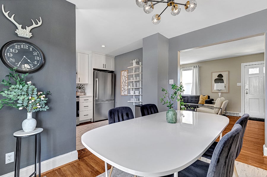 The kitchen, dining room, living room and deck seamlessly connect in an open floor plan.