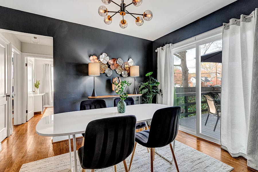 Natural light and deck access make this dining spot ideal for leisurely meals.