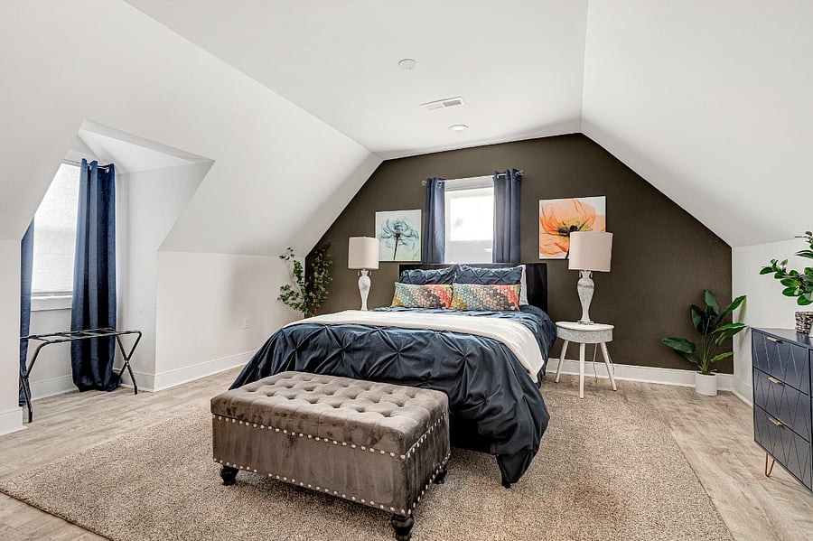 Spacious upstairs Master Suite with vaulted ceilings and abundant natural light.