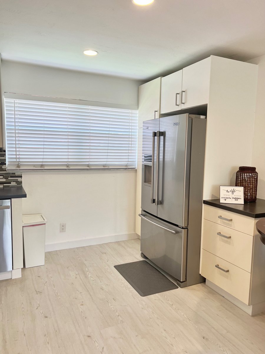 Full size double refrigerator with ice maker and filtered water and plenty of cabinet soace