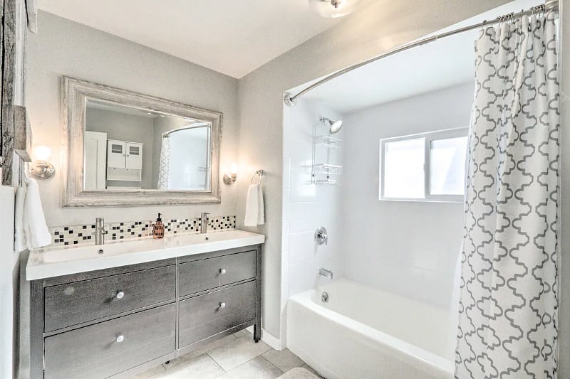 Spacious bathroom on main floor with double sinks.