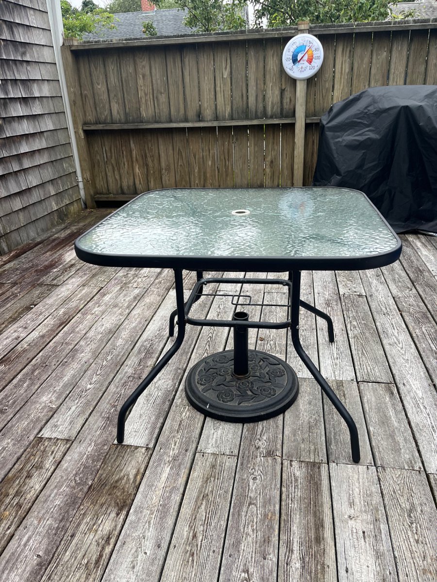 Patio table and and chairs on back deck.