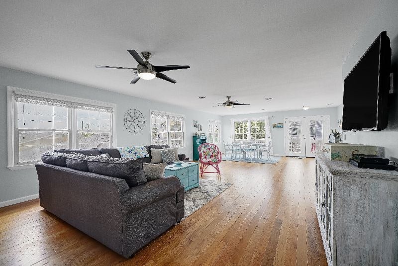 The upstairs unit has an open floor plan with a space for dining and for lounging--all of which can be seen from the pass through breakfast bar connecting to the kitchen.
