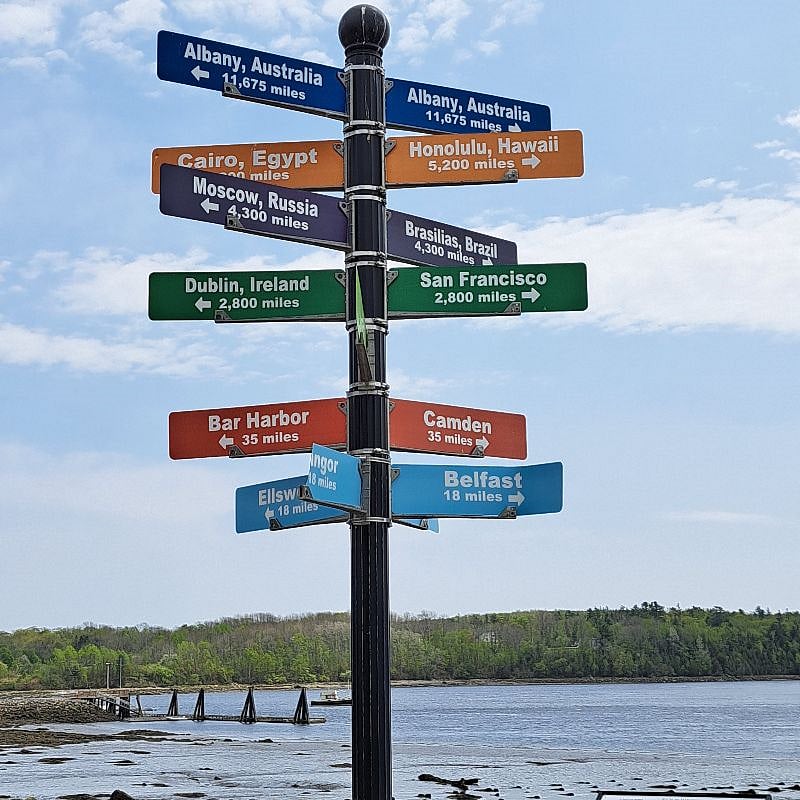 A fun sign on the walkway showing how far various famous cities are from Bucksport (center of the universe)