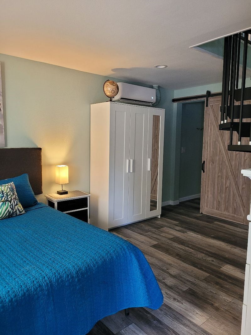 Armoire and entrance to bathroom