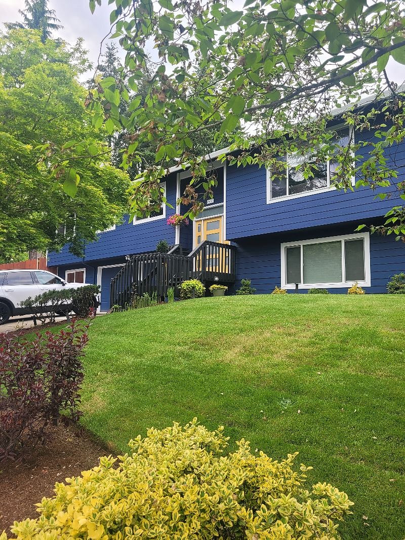 Front of our home. Apartment is located to the left of the garage and has a private entrance behind the gate.