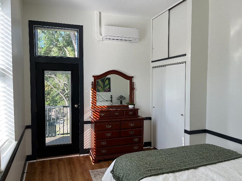 There's plenty of space in the dresser and closet. The back door leads to a balcony.