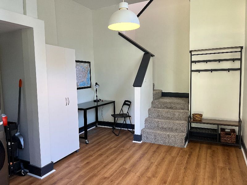 Main level entry with washer, dryer, and desk
