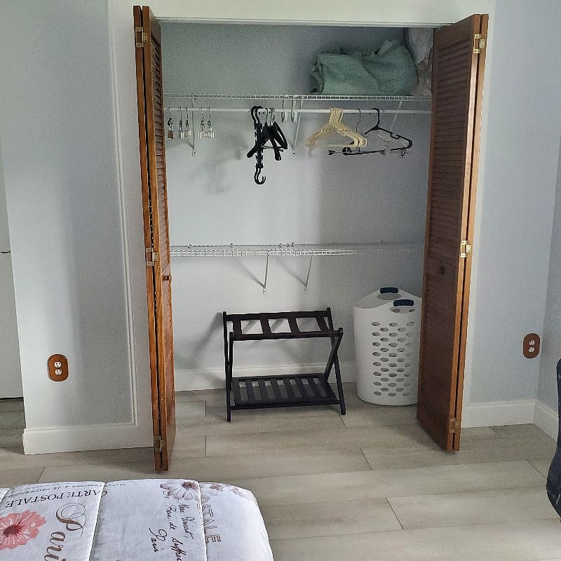 Large closet with lots of shelving and hanging space