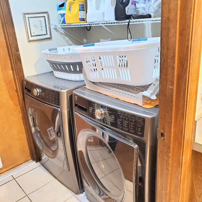 Shared laundry room with laundry detergent and supplies provided