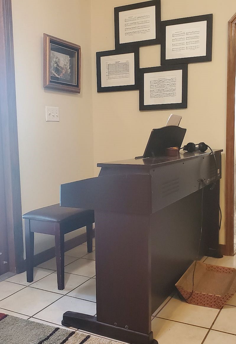 Full size piano with headphones