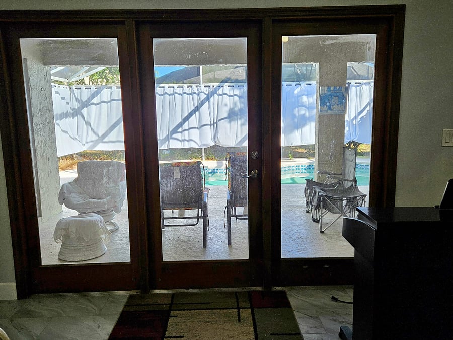 Living room view of lanai and private pool.