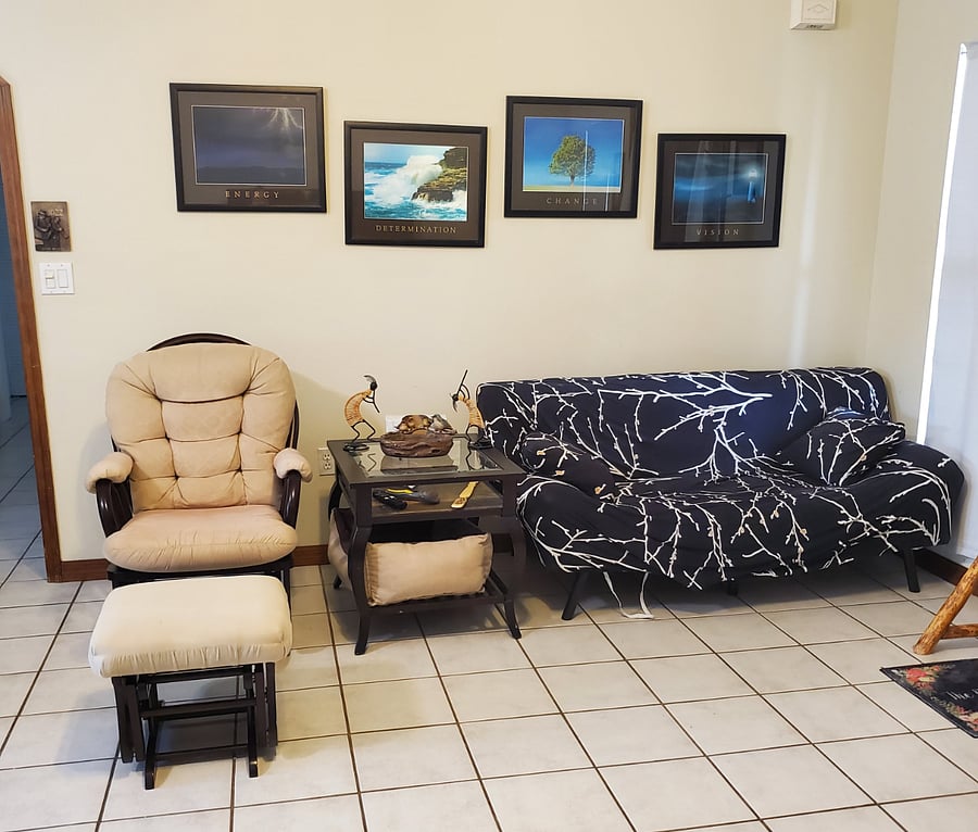 Living room with glider rocker.