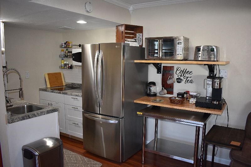 Kitchen with Stove Top, Microwave, Disposal, Dishwasher, Refrigerator/Freezer, Convection Oven, Keurig Coffee and Tea Station. 