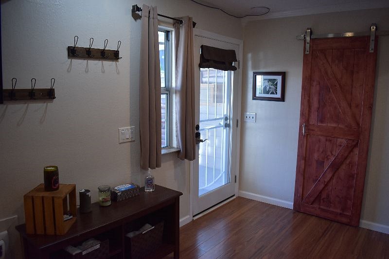 Lower-level door leading to covered patio and backyard/pool areas. 
