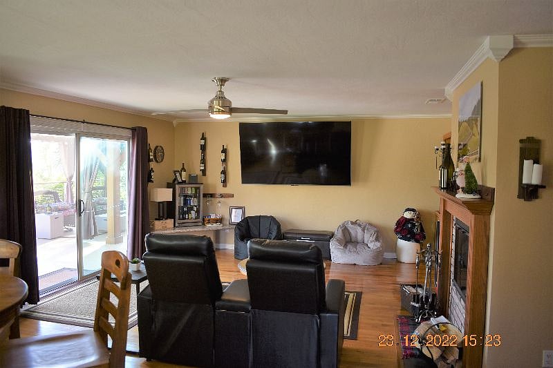 Second floor living area with sliding glass door deck access. 