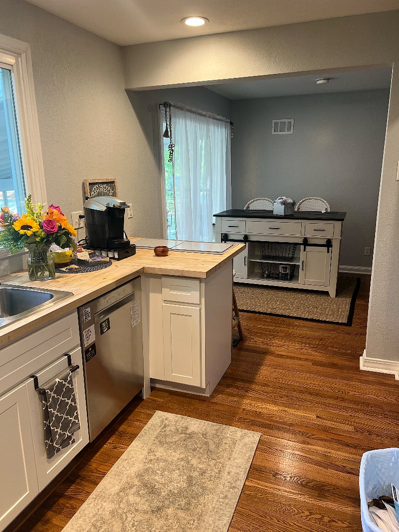 Kitchen looking back to eat in area and Living room