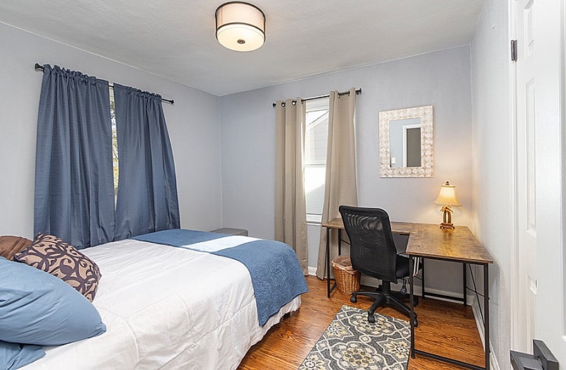 2nd bedroom on main floor nightstand and desk closet
