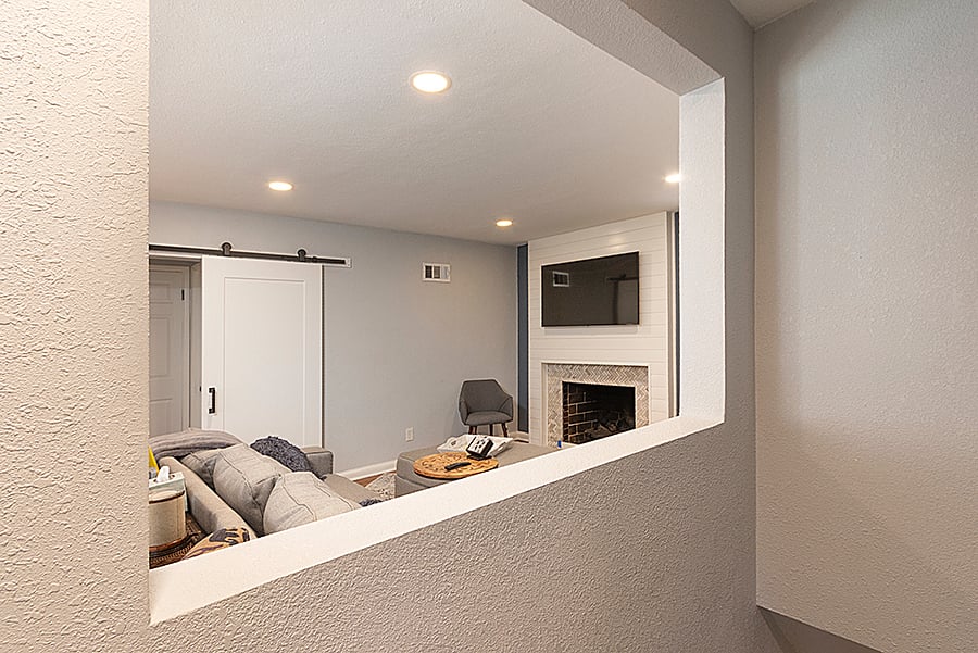 Barn door to the main floor 2 bedrooms and 1 full (shower) bath