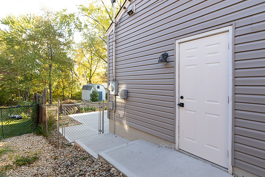 walkway to backyard, this door is exterior entrance to garage