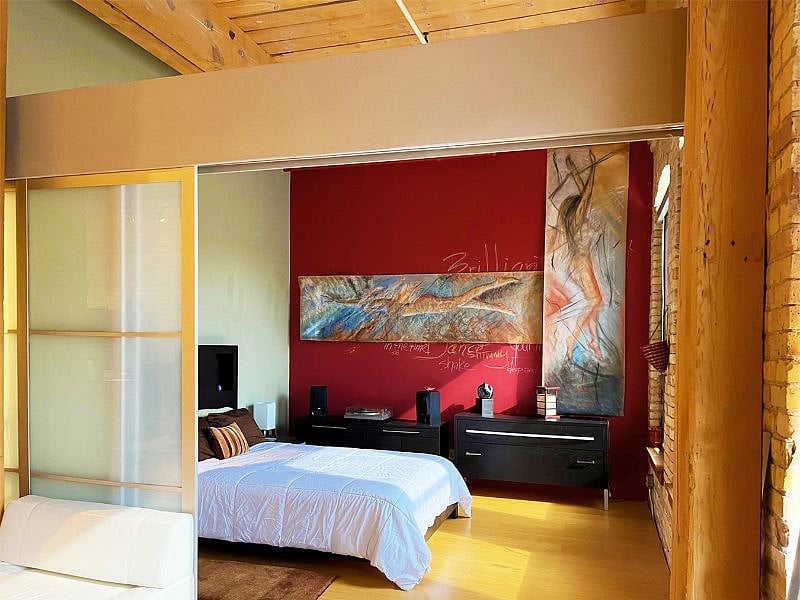 Daylight bathes the Master Bedroom. Pull the frosted glass doors close for privacy or a fresh look!