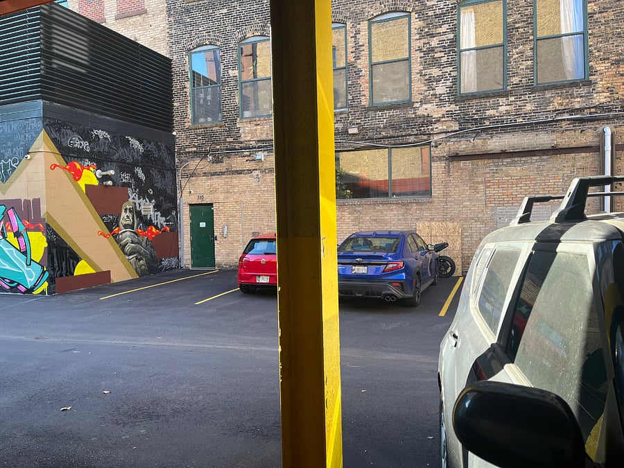 This is the view to the building entry door from the parking spot.