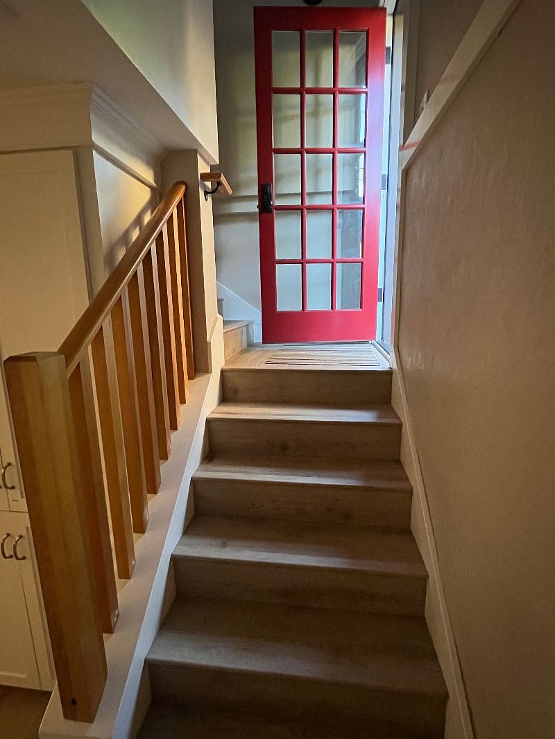 Private entry and stairs down to your space.