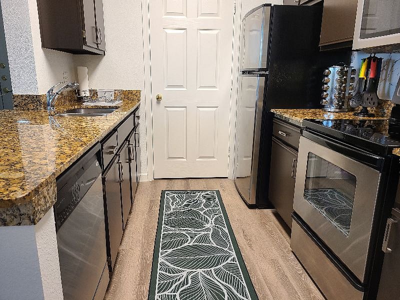 Galley style kitchen with large peninsula