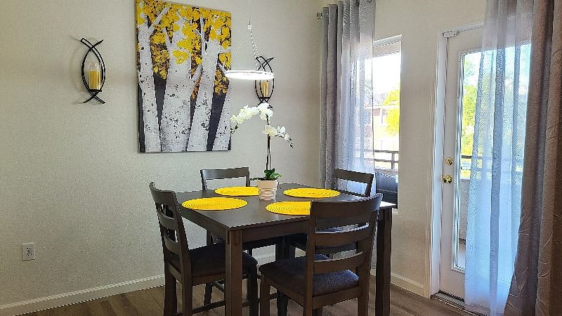 Dining area has access to balcony.