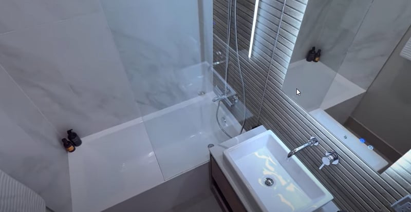 Mountain Modern - Bathroom with floor to ceiling concrete tile. LED lighting, heated floors and mirrors.