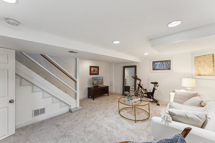 Lower level rec room, couch can fold down to make a twin bed. Not the most comfortable though in that configuration.