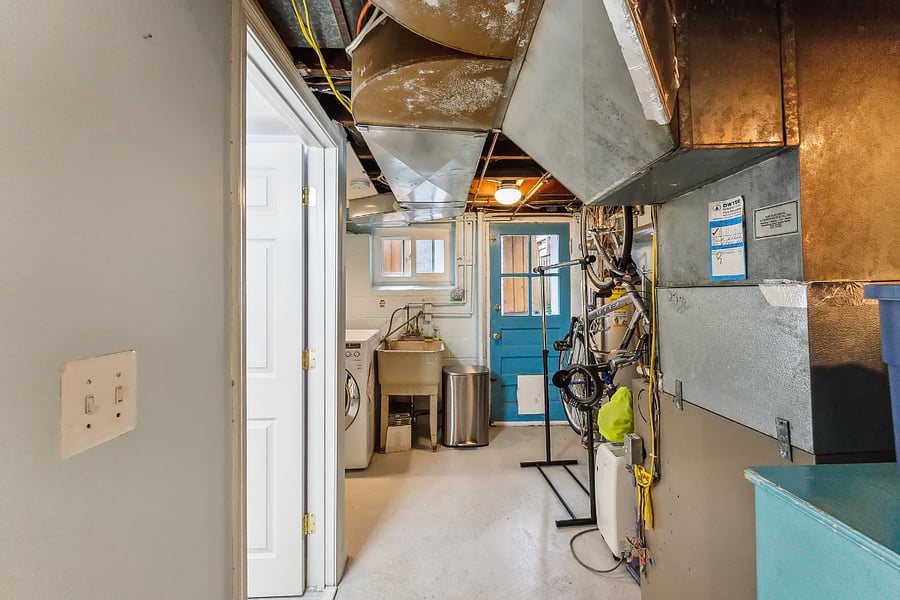 Door to full bath is off the laundry/utility room directly adjacent to rec room.
