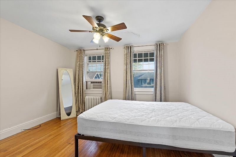 Bedroom #1. AC window unit will be pre-installed for tenant use. Closet extends deeply and provides extra storage space.