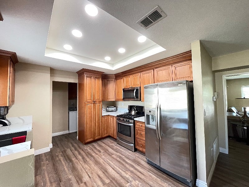 Fully renovated open kitchen - wood cabinets, quartz countertops, appliances